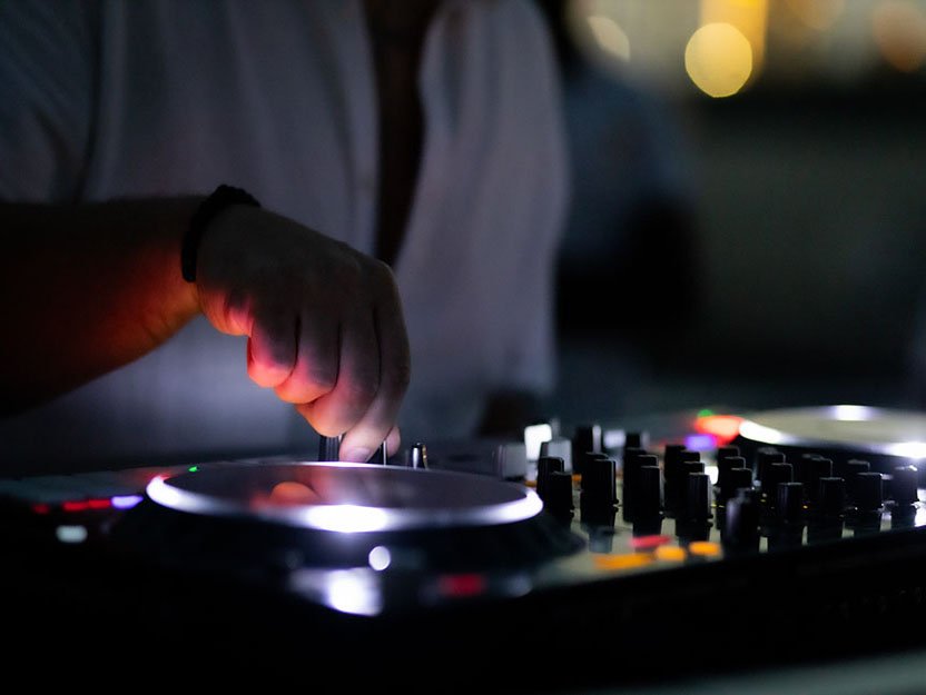 Live DJ performing on Xtreme Yacht